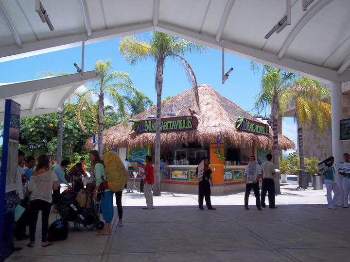 If your flight arrives at terminal number 3, your driver will be waiting for you in front of the Margarita Ville bar outside Terminal 3